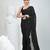 Elegant black cotton saree with sequin embellishments and pom pom