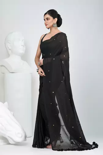 Elegant black cotton saree with sequin embellishments and pom pom