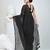 Elegant black cotton saree with sequin embellishments and pom pom