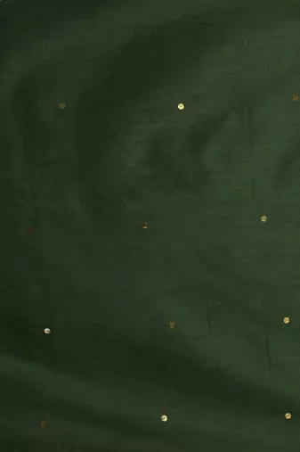 Elegant green cotton saree with sequin embellishments and pom pom