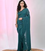 Elegant teal cotton saree with sequin embellishments and pom pom