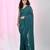 Elegant teal cotton saree with sequin embellishments and pom pom
