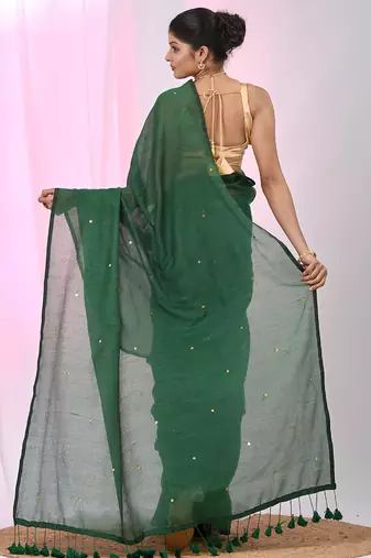 Elegant green cotton saree with sequin embellishments and pom pom