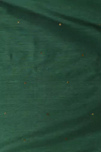 Elegant green cotton saree with sequin embellishments and pom pom