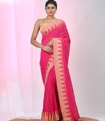 Elegant pink cotton saree with geometric border and pom pom