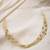 Gold finish multi layers hasli necklace with gold beads