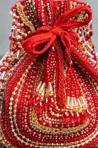 red beaded embroidered silk potli bag