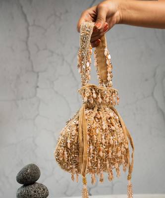gold beaded tassel embroidered silk potli bag 3