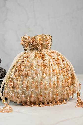 Gold silk embroidered potli bag 