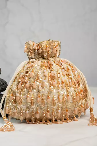 Gold silk embroidered potli bag 