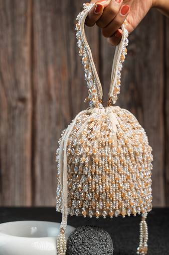 white beaded embroidered suede potli bag
