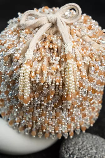 white beaded embroidered suede potli bag