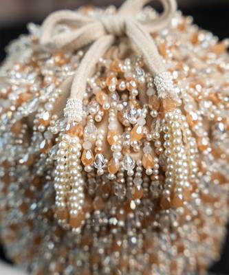 white beaded embroidered suede potli bag 4