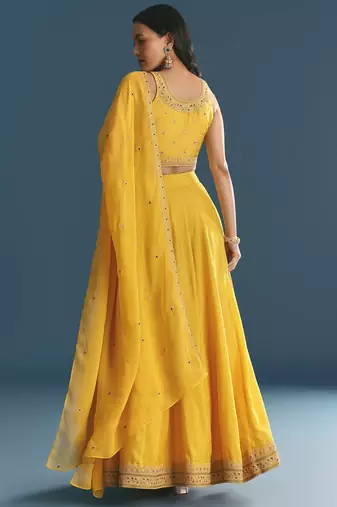 YELLOW SEQUINED EMBROIDERY WORK COTTON SILK WEDDING WEAR LEHENGA CHOLI WITH DUPATTA.