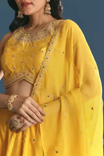 YELLOW SEQUINED EMBROIDERY WORK COTTON SILK WEDDING WEAR LEHENGA CHOLI WITH DUPATTA.
