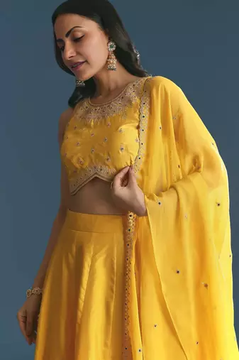 YELLOW SEQUINED EMBROIDERY WORK COTTON SILK WEDDING WEAR LEHENGA CHOLI WITH DUPATTA.