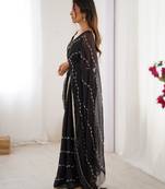Black color beads work celebrity style saree with blouse