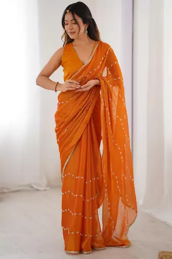 Orange color beads work celebrity style saree with blouse