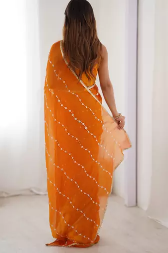 Orange color beads work celebrity style saree with blouse