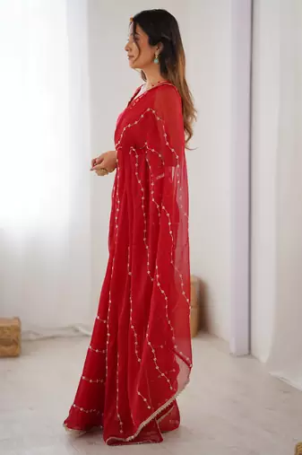 Red color beads work celebrity style saree with blouse