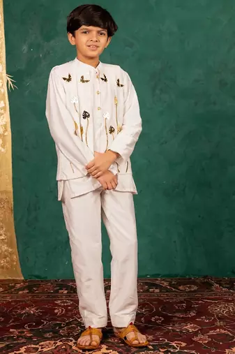 Boys white silk kurta and pants with handwork acrylic bundi jacket
