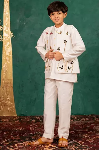 Boys white silk kurta and pants with handwork acrylic bundi jacket