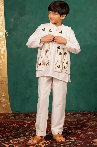 Boys white silk kurta and pants with handwork acrylic bundi jacket