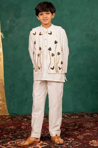 Boys white silk kurta and pants with handwork acrylic bundi jacket