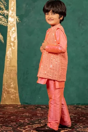Boys bright salmon coloured kurta and pant with georgette mirror work bundi jacket