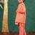 Boys bright salmon coloured kurta and pant with georgette mirror work bundi jacket