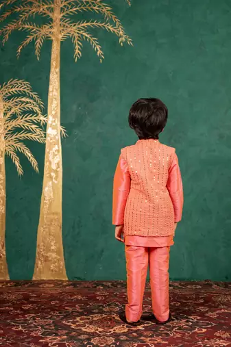 Boys bright salmon coloured kurta and pant with georgette mirror work bundi jacket