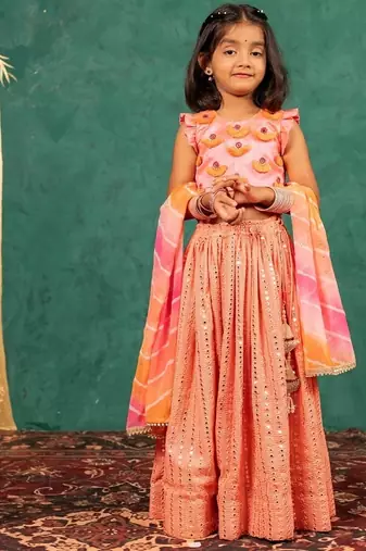 Girls pink salmon coloured mirror handworked top and mirror embroidered georgette lehenga with dupatta