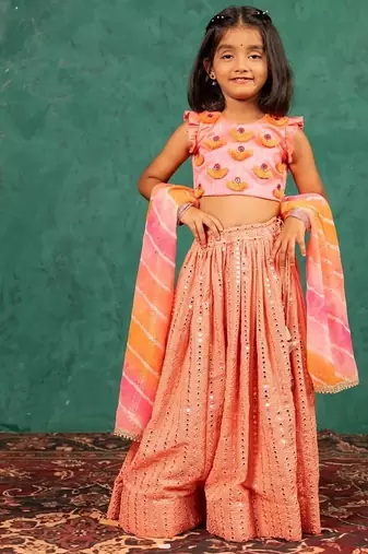 Girls pink salmon coloured mirror handworked top and mirror embroidered georgette lehenga with dupatta