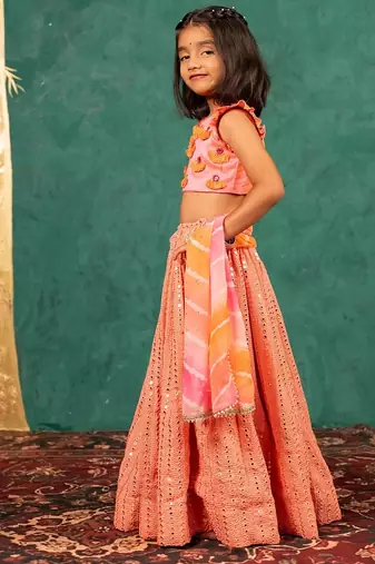 Girls pink salmon coloured mirror handworked top and mirror embroidered georgette lehenga with dupatta