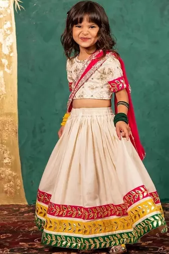 Girls off-white elbow sleeve top and lehenga with georgette dupatta