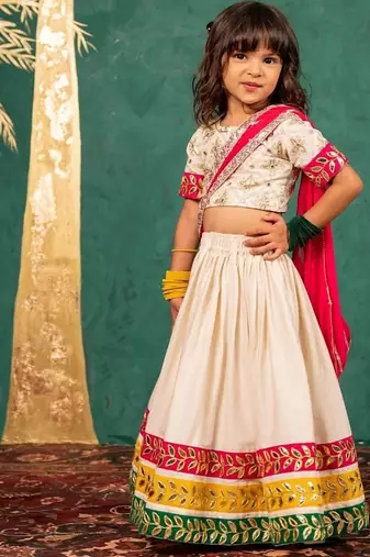 Girls off-white elbow sleeve top and lehenga with georgette dupatta