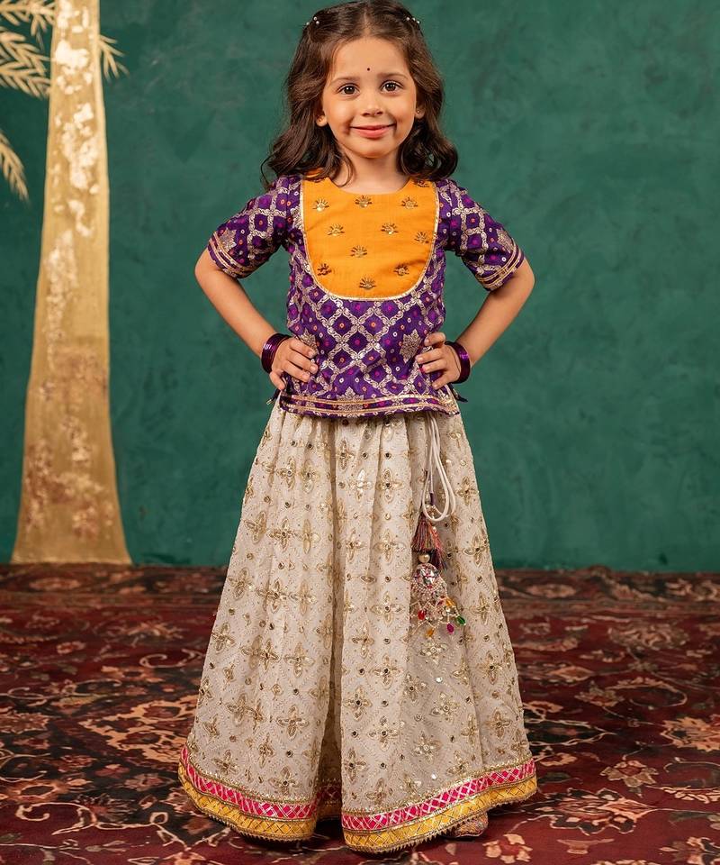 Girls handworked dark purple top and off-white lehenga