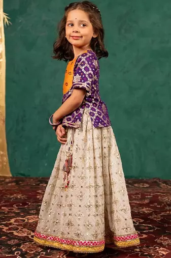 Girls handworked dark purple top and off-white lehenga