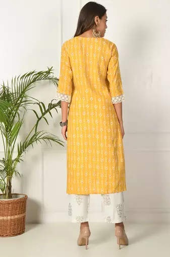Women yellow rayon printed & trim work kurta bottom set