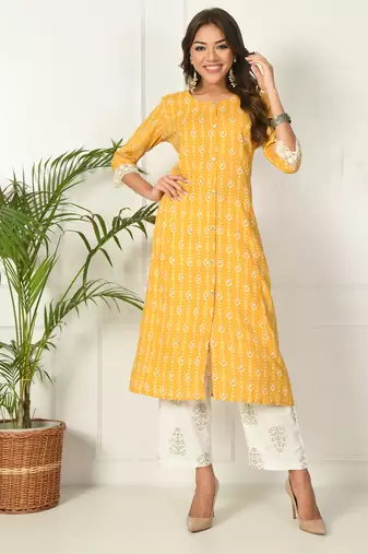 Women yellow rayon printed & trim work kurta bottom set