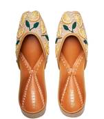 Beige embroidered leather juttis