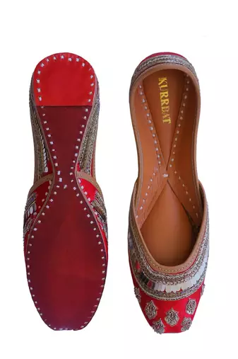 Red embroidered leather juttis