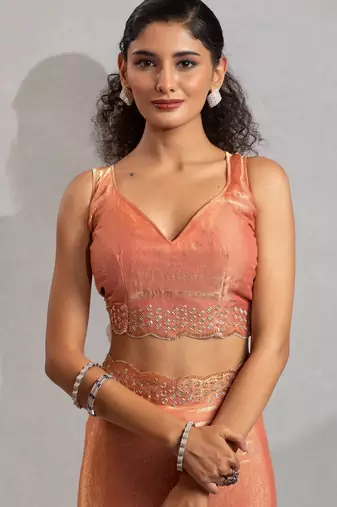 Peach hand work zarkan with cutdana work border fendy silk blend two tone saree with blouse