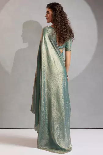 Ice blue color hand work zarkan with cutdana work border fendy silk blend two tone saree with blouse