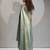 Ice blue color hand work zarkan with cutdana work border fendy silk two tone saree with blouse