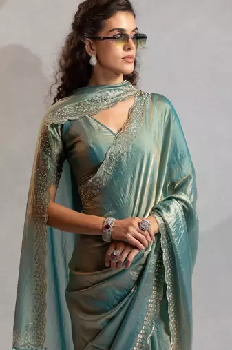Ice blue color hand work zarkan with cutdana work border fendy silk blend two tone saree with blouse