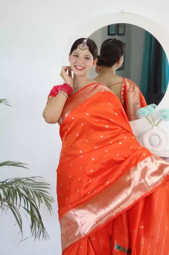 Orange paithani silk blend saree with festive looks