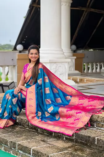 Teal blue woven meenakari faux banarasi silk blend saree