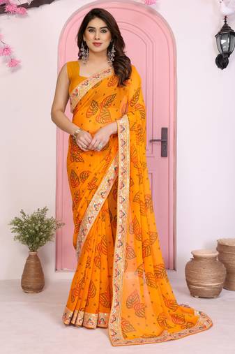 Orange color beautiful printed georgette saree with embroidered lace border