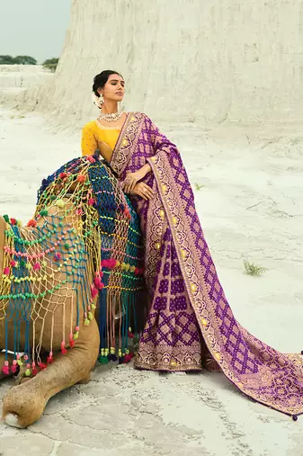 Purple embroidered faux georgette bandhej saree